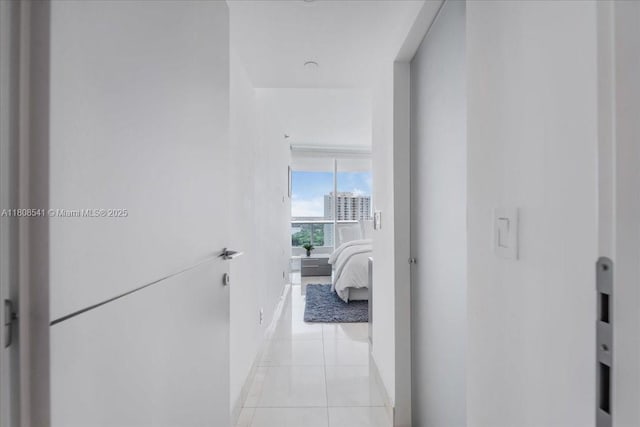 2127 Brickell Ave Unit 2302, Miami, FL 33129 - hallway featuring baseboards and light tile patterned flooring