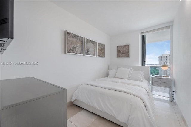 2127 Brickell Ave Unit 2302, Miami, FL 33129 - bedroom with light tile patterned floors