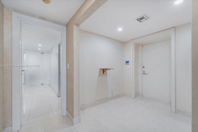 2127 Brickell Ave Unit 2302, Miami, FL 33129 - hall with recessed lighting, light tile patterned flooring, and baseboards