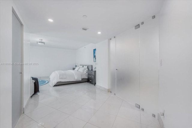 2127 Brickell Ave Unit 2302, Miami, FL 33129 - bedroom with recessed lighting, light tile patterned floors, and baseboards