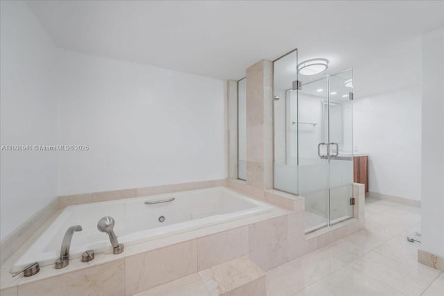 2127 Brickell Ave Unit 2302, Miami, FL 33129 - bathroom with a garden tub and a shower stall