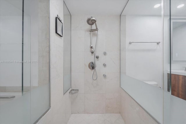 2127 Brickell Ave Unit 2302, Miami, FL 33129 - bathroom featuring a walk in shower, vanity, and toilet