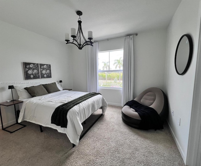 245 NE 3rd Ct, Florida City, FL 33034 - carpeted bedroom featuring a chandelier and baseboards