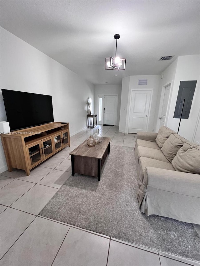 245 NE 3rd Ct, Florida City, FL 33034 - living area with electric panel, light tile patterned floors, and baseboards