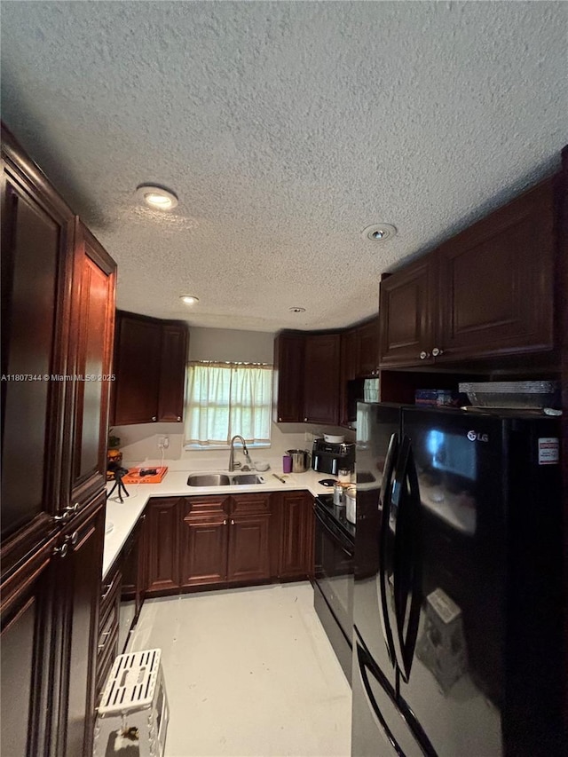 3107 NW 2nd Ter, Pompano Beach, FL 33064 - kitchen featuring black appliances, a sink, a textured ceiling, light countertops, and recessed lighting