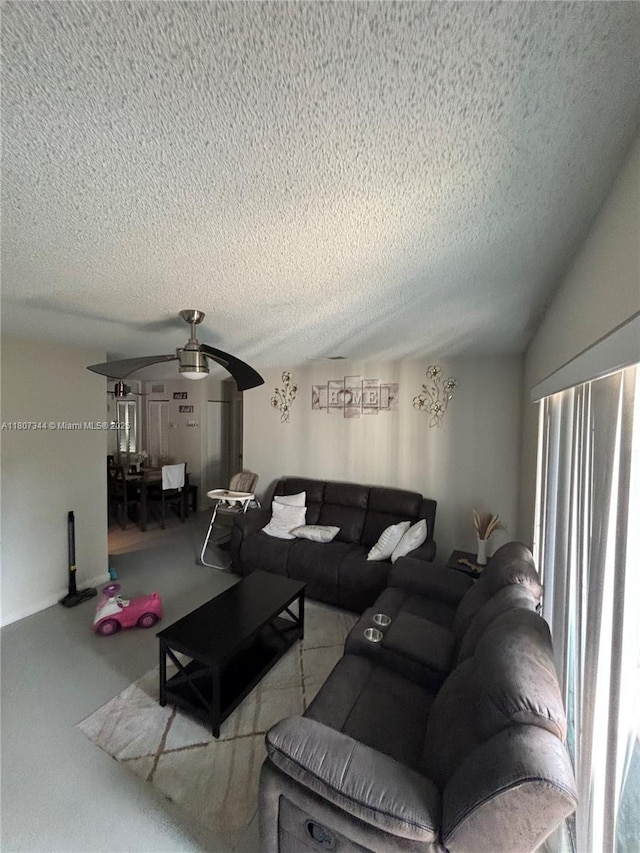 3107 NW 2nd Ter, Pompano Beach, FL 33064 - living area featuring ceiling fan and a textured ceiling