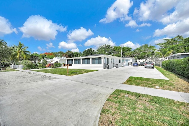 12400 NE 11th Ct, North Miami, FL 33161 - view of front of house featuring concrete driveway
