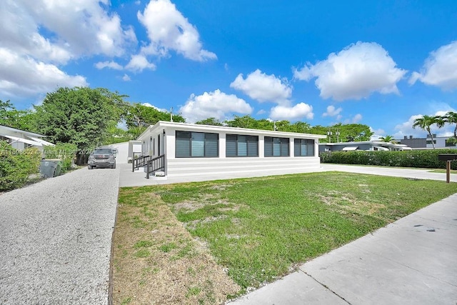 12400 NE 11th Ct, North Miami, FL 33161 - view of front of house featuring a front lawn