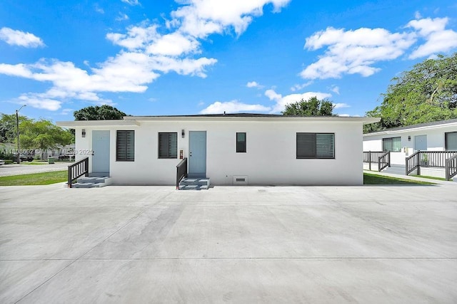 12400 NE 11th Ct, North Miami, FL 33161 - rear view of house with stucco siding