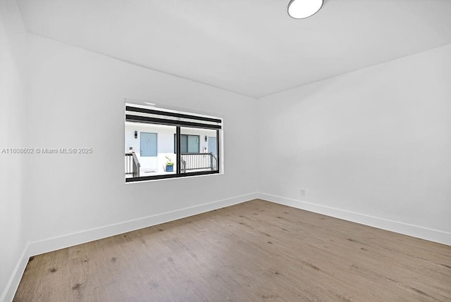 12400 NE 11th Ct, North Miami, FL 33161 - unfurnished room featuring wood finished floors and baseboards