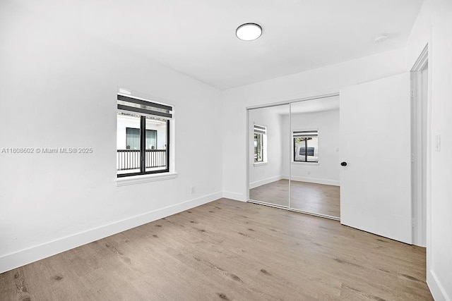 12400 NE 11th Ct, North Miami, FL 33161 - empty room with wood finished floors and baseboards