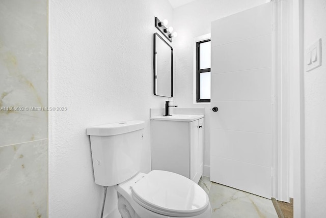 12400 NE 11th Ct, North Miami, FL 33161 - bathroom with vanity, toilet, and marble look tile flooring