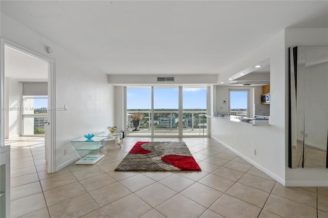 2841 N Ocean Blvd Unit 1105, Fort Lauderdale, FL 33308 - living area featuring light tile patterned floors, baseboards, and recessed lighting