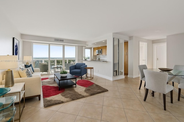 2841 N Ocean Blvd Unit 1105, Fort Lauderdale, FL 33308 - living area featuring light tile patterned floors and baseboards