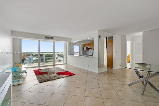 2841 N Ocean Blvd Unit 1105, Fort Lauderdale, FL 33308 - unfurnished living room featuring light tile patterned floors