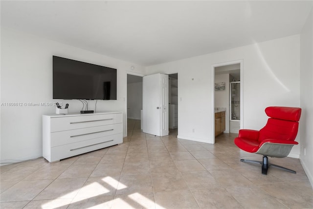 2841 N Ocean Blvd Unit 1105, Fort Lauderdale, FL 33308 - bedroom with light tile patterned flooring, baseboards, and ensuite bathroom