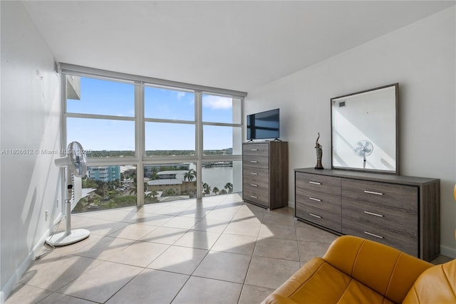 2841 N Ocean Blvd Unit 1105, Fort Lauderdale, FL 33308 - bedroom featuring a wall of windows, multiple windows, and light tile patterned flooring