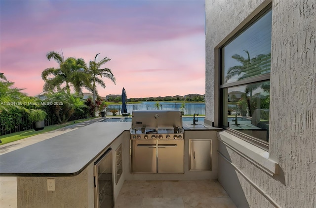 8575 Baypoint Cir, Parkland, FL 33076 - patio terrace at dusk with wine cooler