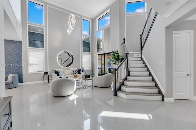 8575 Baypoint Cir, Parkland, FL 33076 - tiled entryway featuring stairs, a high ceiling, and baseboards