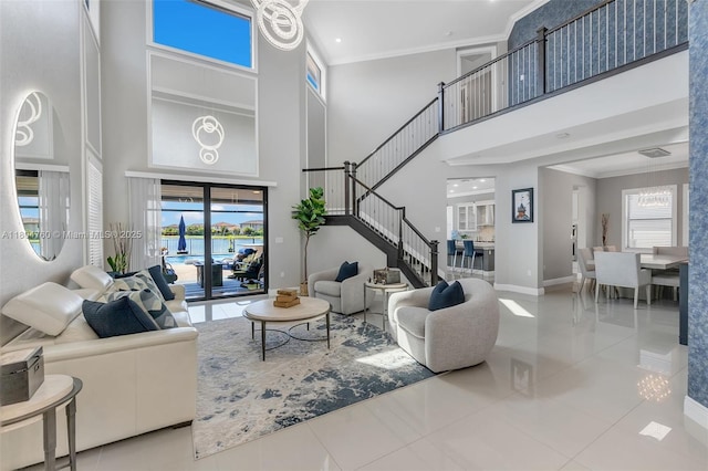 8575 Baypoint Cir, Parkland, FL 33076 - living area with a high ceiling, stairs, baseboards, healthy amount of natural light, and tile patterned flooring