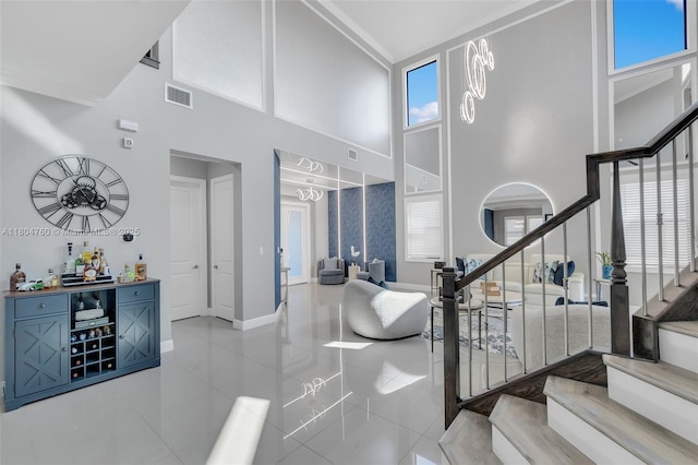 8575 Baypoint Cir, Parkland, FL 33076 - stairs featuring a towering ceiling, tile patterned flooring, and baseboards