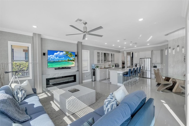 8575 Baypoint Cir, Parkland, FL 33076 - living area featuring recessed lighting, a ceiling fan, crown molding, and light tile patterned floors