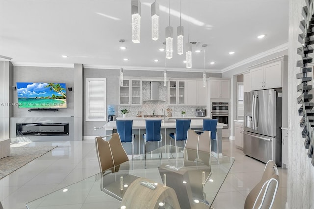 8575 Baypoint Cir, Parkland, FL 33076 - dining space featuring light tile patterned floors, ornamental molding, and recessed lighting