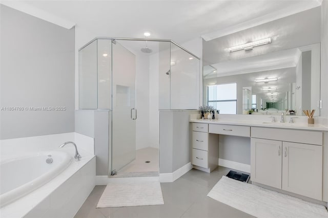 8575 Baypoint Cir, Parkland, FL 33076 - bathroom with a stall shower, a garden tub, vanity, tile patterned flooring, and baseboards