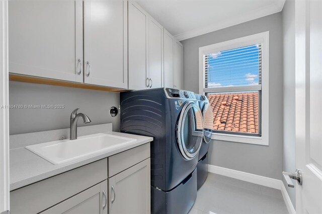 8575 Baypoint Cir, Parkland, FL 33076 - washroom featuring washing machine and clothes dryer, cabinet space, and baseboards