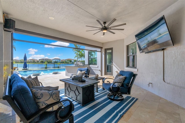 8575 Baypoint Cir, Parkland, FL 33076 - view of patio / terrace featuring an outdoor living space, an outdoor pool, a ceiling fan, an outdoor kitchen, and a water view