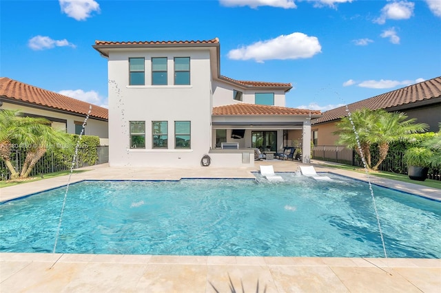 8575 Baypoint Cir, Parkland, FL 33076 - rear view of house featuring a patio area, a tiled roof, stucco siding, and area for grilling
