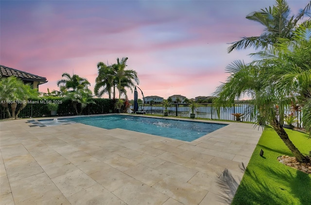8575 Baypoint Cir, Parkland, FL 33076 - pool at dusk with a patio