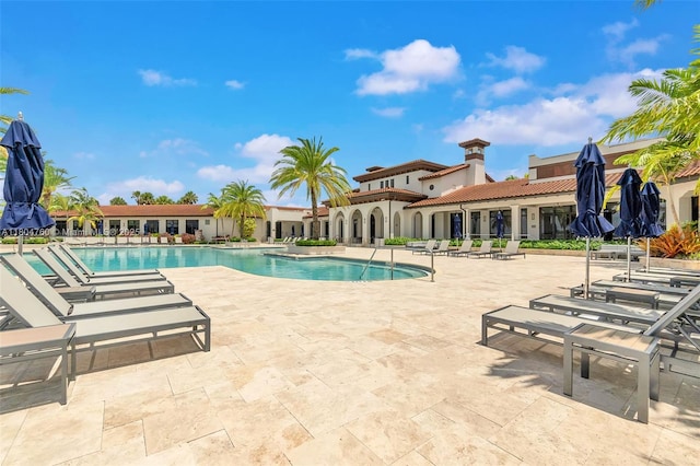 8575 Baypoint Cir, Parkland, FL 33076 - community pool featuring a patio area