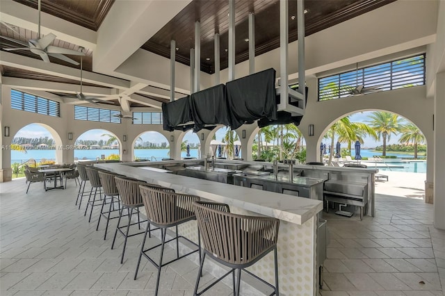 8575 Baypoint Cir, Parkland, FL 33076 - view of patio featuring an outdoor kitchen, a balcony, and a community pool