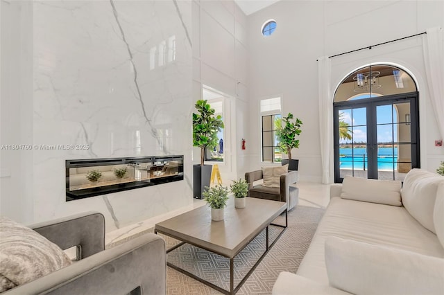 8575 Baypoint Cir, Parkland, FL 33076 - living area featuring french doors and a towering ceiling