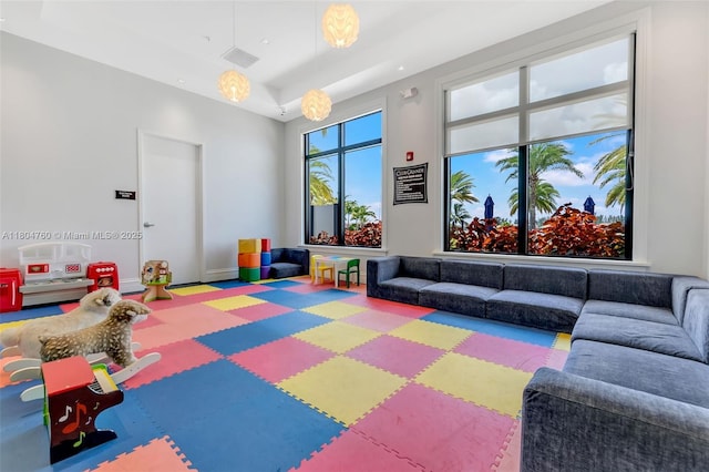 8575 Baypoint Cir, Parkland, FL 33076 - playroom with baseboards, a raised ceiling, tile patterned floors, and recessed lighting