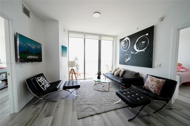 2900 NE 7th Ave Unit 1705, Miami, FL 33137 - living room featuring expansive windows and wood finished floors