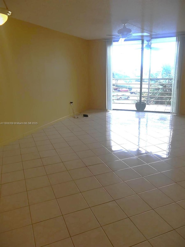 1800 SW 81st Ave Unit 1411, North Lauderdale, FL 33068 - tiled empty room with baseboards