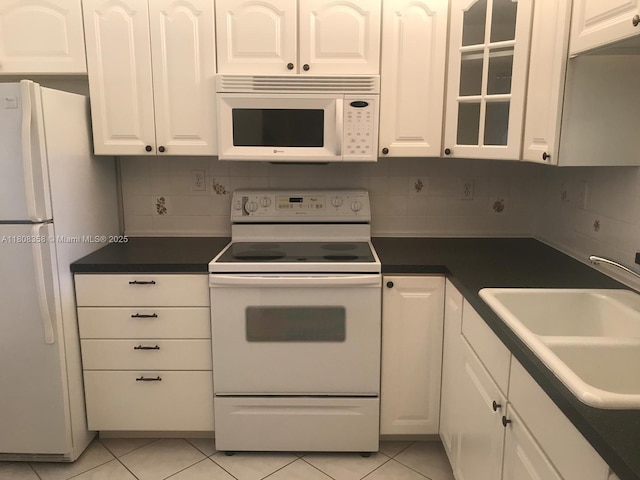 1800 SW 81st Ave Unit 1411, North Lauderdale, FL 33068 - kitchen featuring white appliances, a sink, white cabinetry, and light tile patterned floors