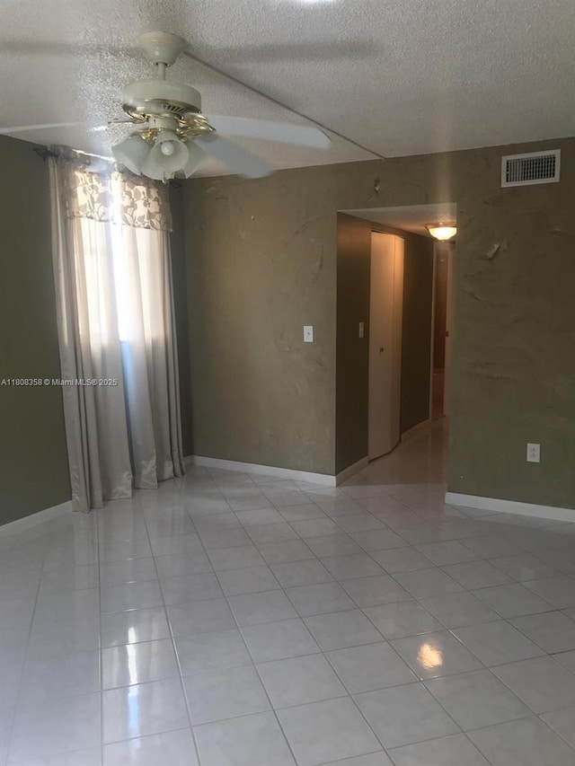 1800 SW 81st Ave Unit 1411, North Lauderdale, FL 33068 - spare room with a ceiling fan, a textured ceiling, and light tile patterned flooring