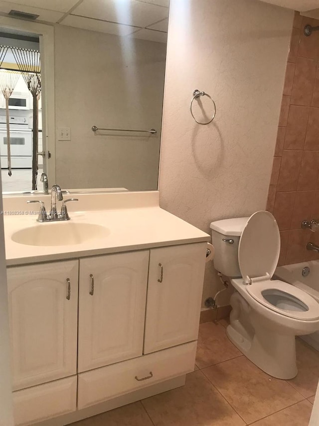 1800 SW 81st Ave Unit 1411, North Lauderdale, FL 33068 - full bath featuring vanity, toilet, tile patterned flooring, and washtub / shower combination