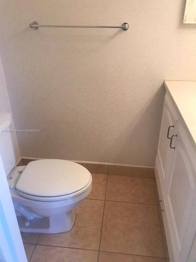 1800 SW 81st Ave Unit 1411, North Lauderdale, FL 33068 - bathroom with vanity, toilet, tile patterned floors, and baseboards