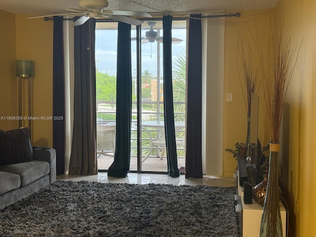 1800 SW 81st Ave Unit 1411, North Lauderdale, FL 33068 - tiled living area featuring ceiling fan, a wall of windows, and plenty of natural light