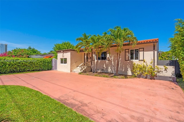 1901 SW 37th Ave, Miami, FL 33145 - view of front of house with stucco siding and driveway