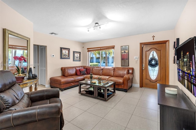 1901 SW 37th Ave, Miami, FL 33145 - living area with plenty of natural light, light tile patterned flooring, a textured ceiling, and baseboards
