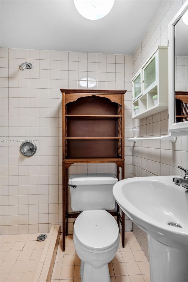 1901 SW 37th Ave, Miami, FL 33145 - bathroom with tile walls, tile patterned floors, tiled shower, toilet, and a sink