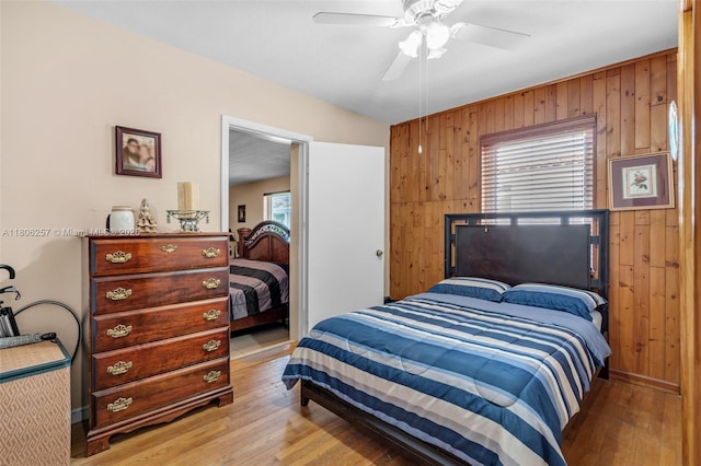 1901 SW 37th Ave, Miami, FL 33145 - bedroom featuring wooden walls, hardwood / wood-style floors, and a ceiling fan