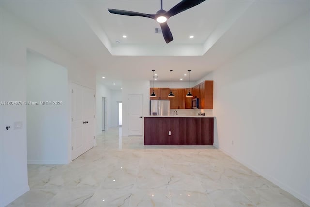 921 Winters St E, Lehigh Acres, FL 33974 - unfurnished living room featuring recessed lighting, baseboards, ceiling fan, a sink, and a raised ceiling