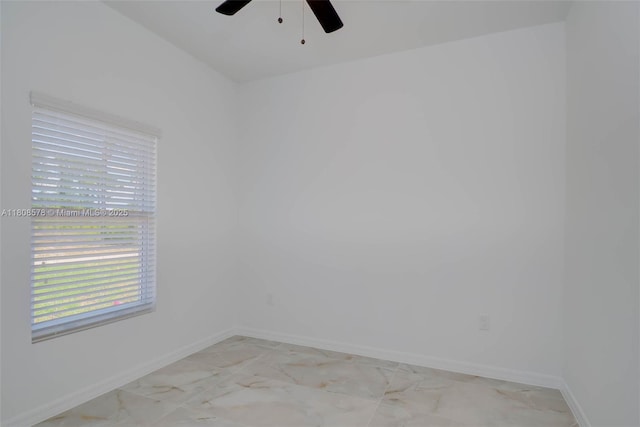 921 Winters St E, Lehigh Acres, FL 33974 - spare room featuring a ceiling fan and baseboards