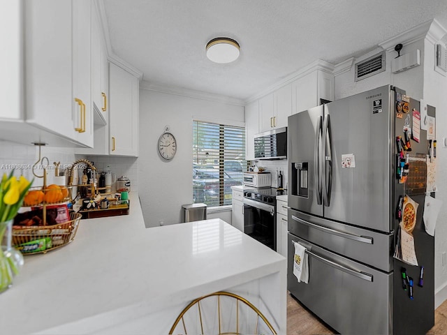 12749 SW 71st Ter, Miami, FL 33183 - kitchen featuring stainless steel appliances, light countertops, decorative backsplash, white cabinets, and crown molding